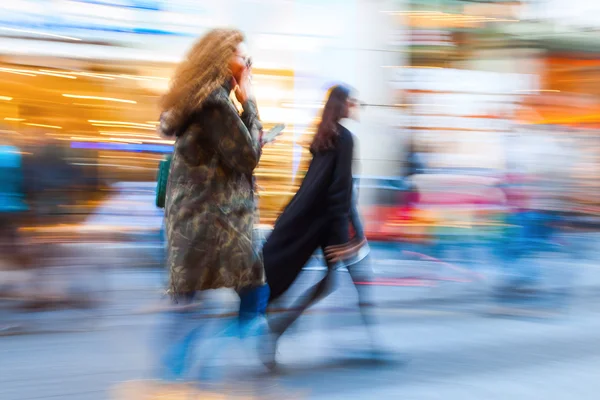 Shopping people in the city in motion blur
