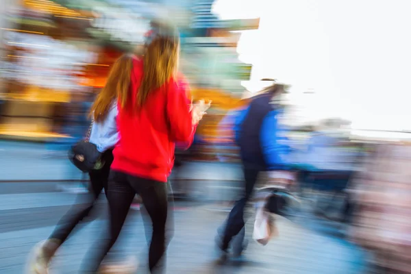 Shopping people in the city in motion blur