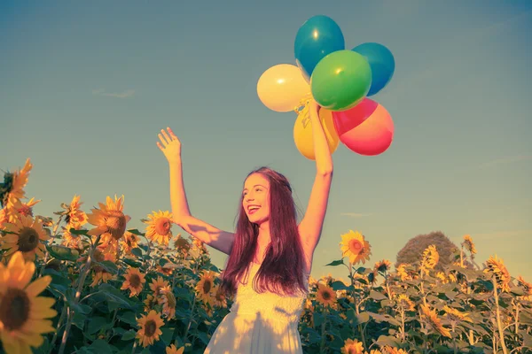 Retro colored picture of a cute girl with balloons