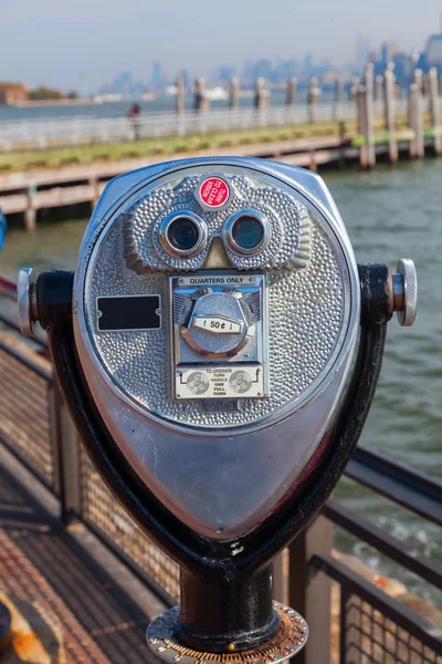 Antique binoculars on Liberty Island with view to Manhattan, NYC