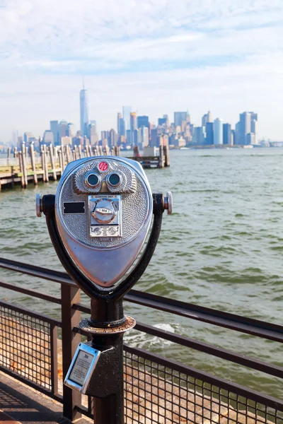 Antique binoculars on Liberty Island with view to Manhattan, NYC
