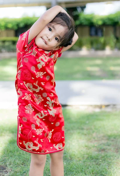 Asian thai girl in chinese dress suite in exercise action
