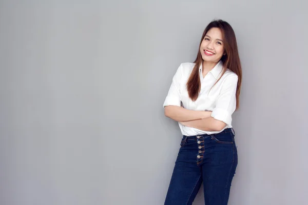 Asian lady action with white shirt and jeans