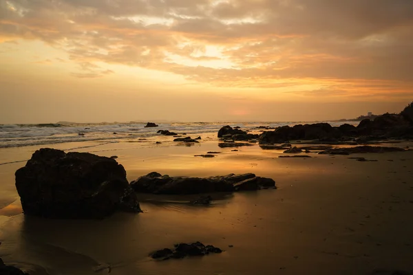 Summer sunset at the rocky beach in front of 6-star beach front hotel for a perfect hide away holidays alone or even better with family who can enjoy outdoor activities, seafood and unforgettable stay