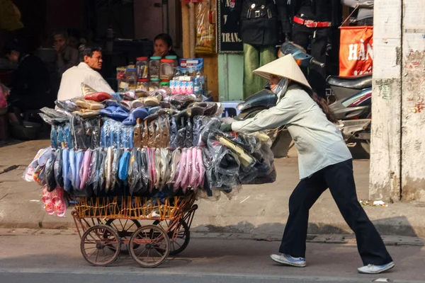 Street vendor selling slippers