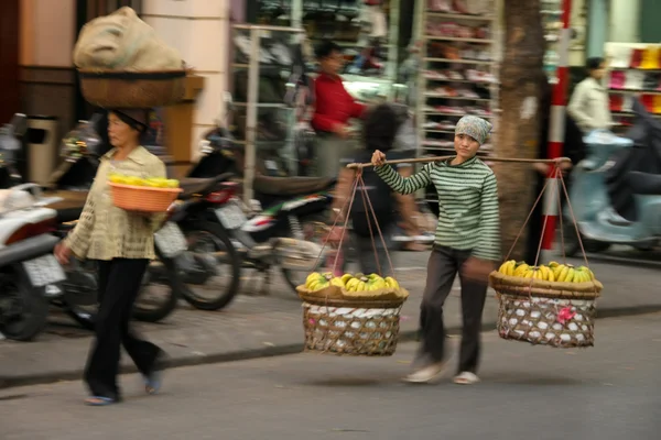 Street vendor bananas from baskets