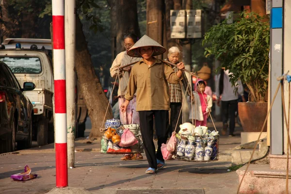 Street vendor sells items from baskets