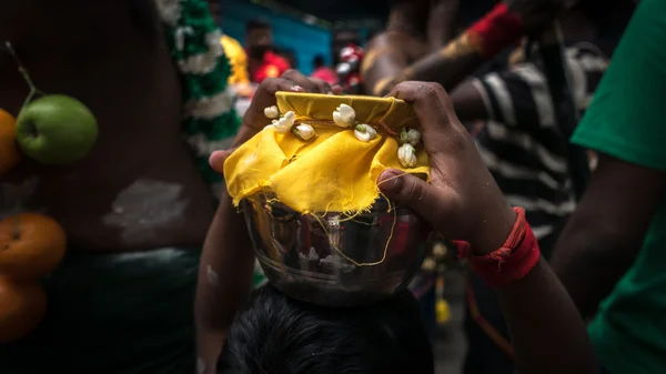 Carry milk pot on the head