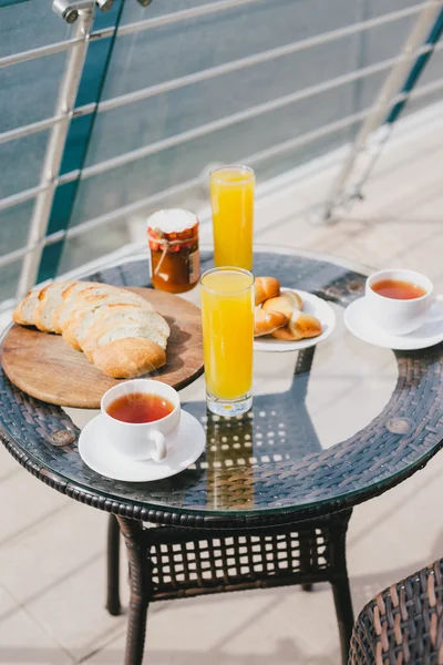 Breakfast for two persons on a balcony with beautiful sea view