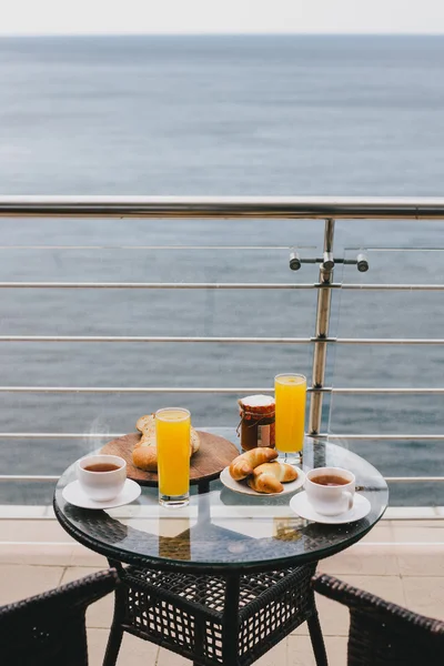 Breakfast for two persons on a balcony with beautiful sea view