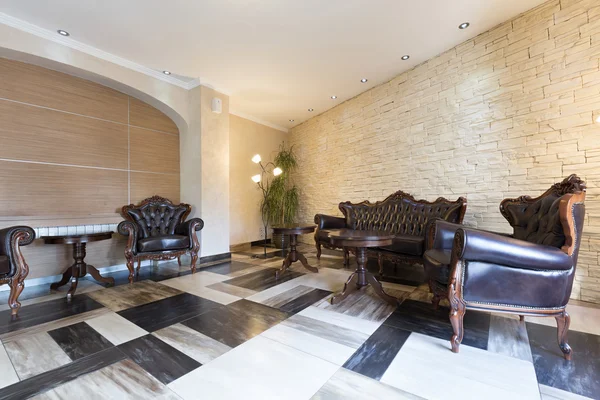 Interior of a hotel lobby with luxury leather furniture