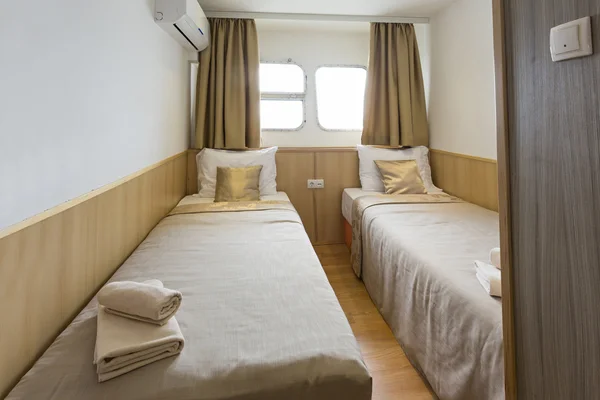 Interior of a cabin bedroom on cruise boat hotel