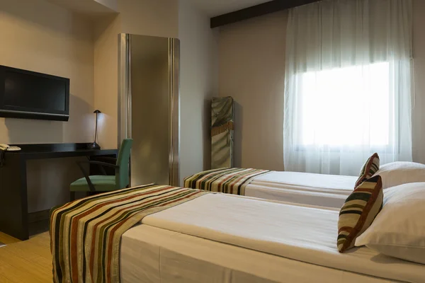 Double bed hotel room interior