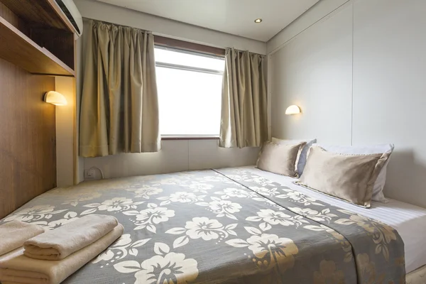 Interior of a cabin bedroom on cruise boat hotel