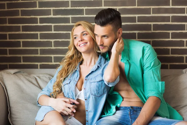 Young attractive couple relaxing at home