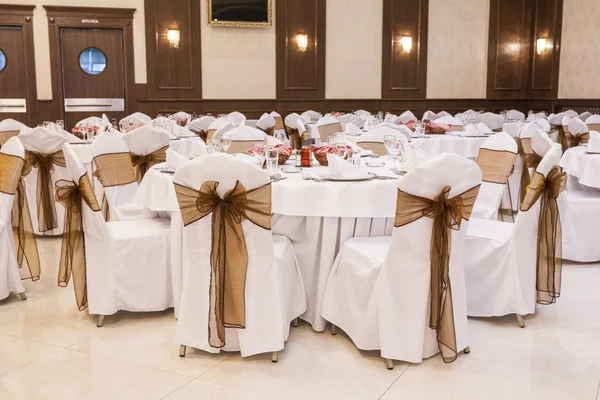 Arranged tables at banquet hall