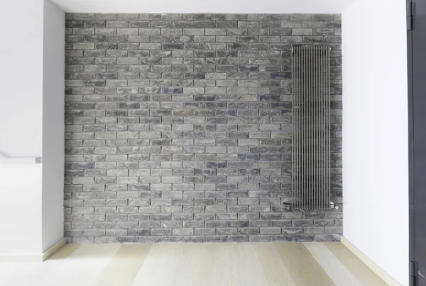 Gray brick wall with radiator