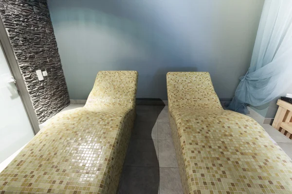 Hot stone chairs in spa interior