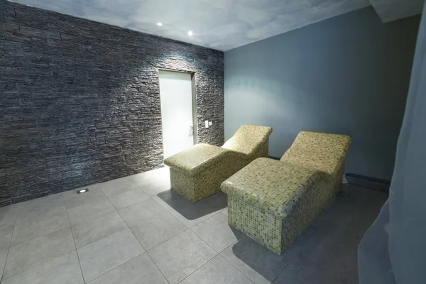 Hot stone chairs in spa interior