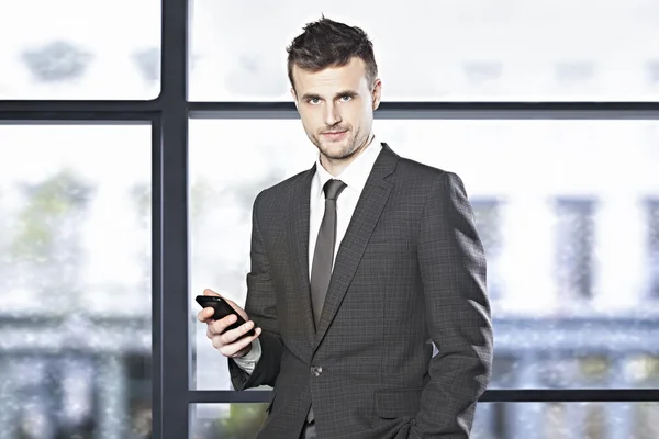 Handsome businessman with phone