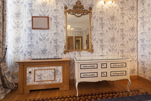 Vintage cabinet and mirror in fancy room interior