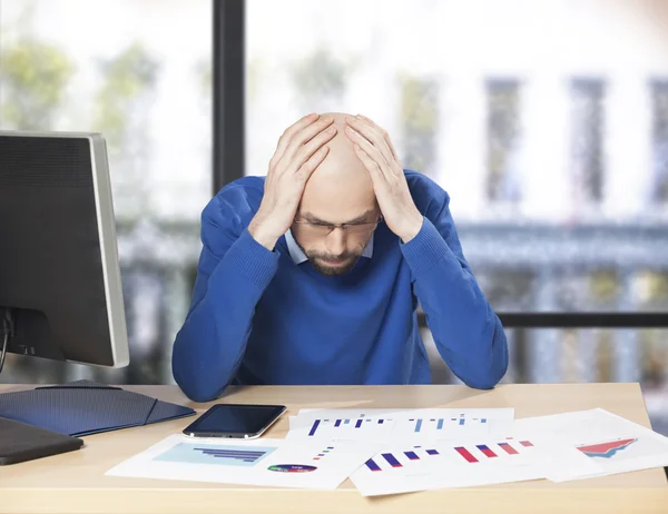 Frustrated businessman at office desk