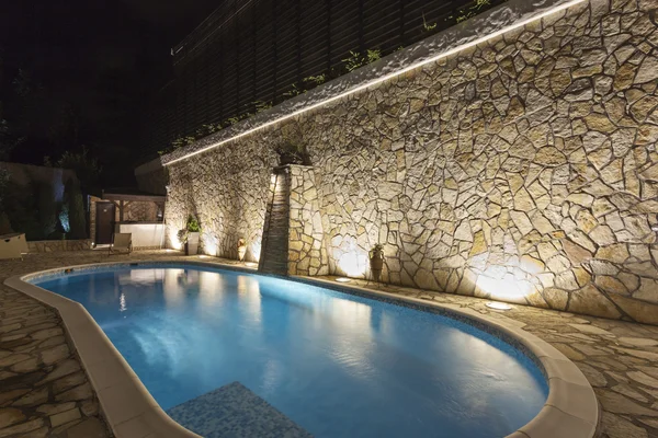 Private swimming pool at night