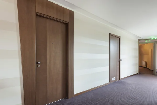 Building corridor with two doors