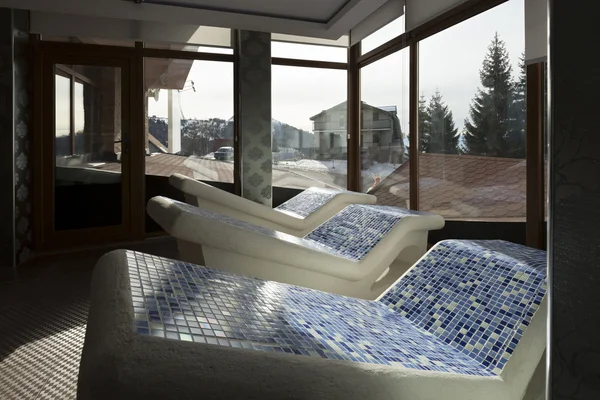 Heated stone chairs at spa center