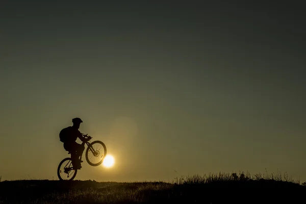 Mountain bike rides at sunrise