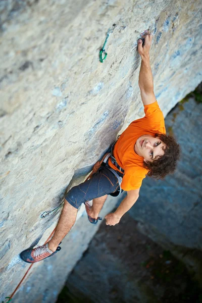 Male rock climber on the cliff