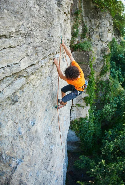 Male rock climber on the cliff