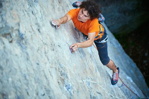 Male rock climber on the cliff