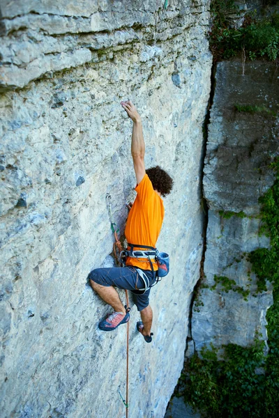 Male rock climber on the cliff