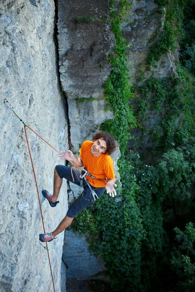 Male rock climber on the cliff