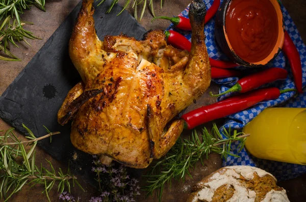 Grilled chicken on a can of beer