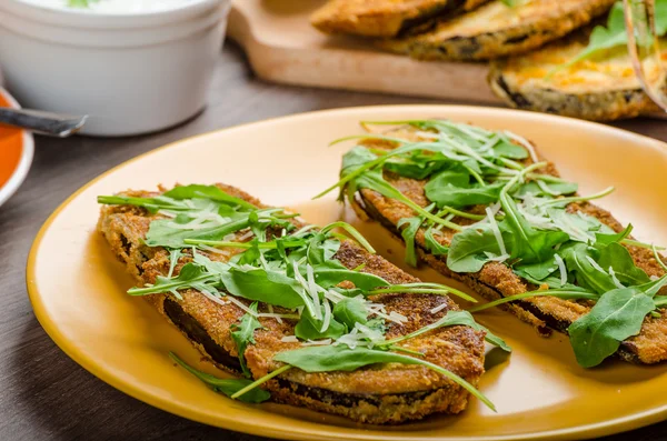 Breaded eggplant parmesan and arugula