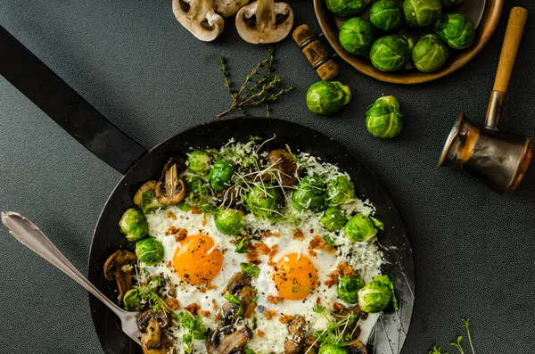 Vegetable omelet with bulls eye egg and sprouts