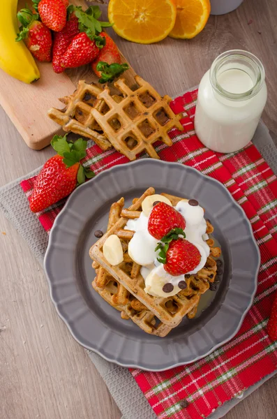 Belgian waffles with chocolate chips and fruits