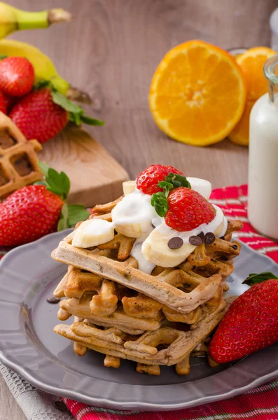 Belgian waffles with chocolate chips and fruits