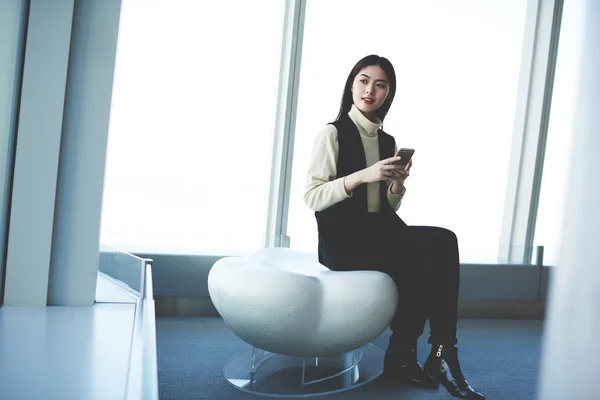 Young woman using cellular phone