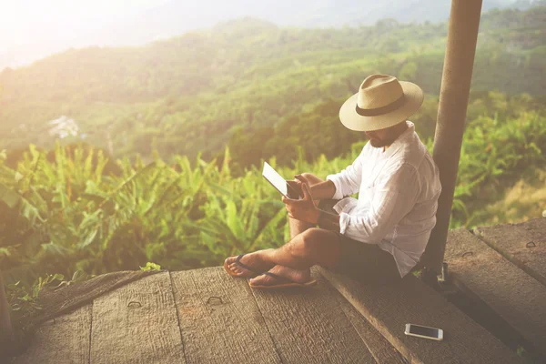 Man traveler reading electronic book