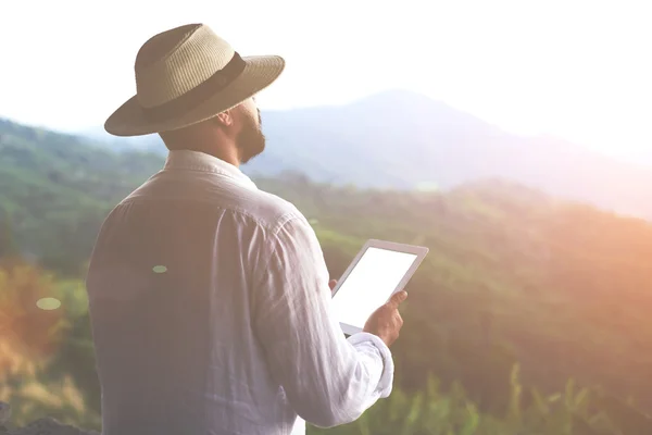 Man tourist holding digital tablet