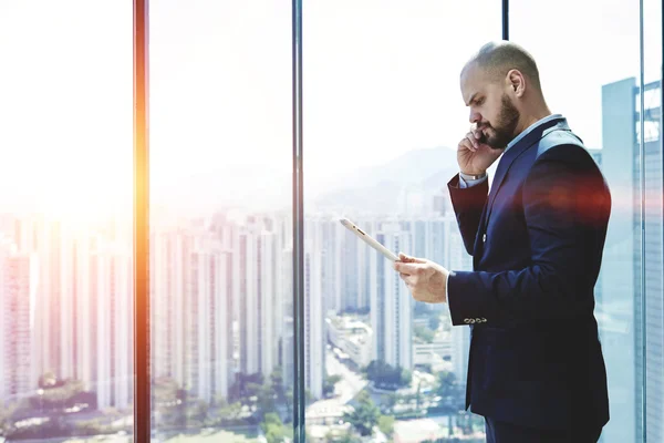 Professional banker having mobile conversation