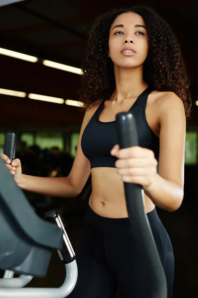 Woman with curly hair working out