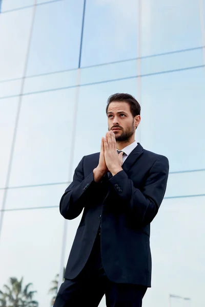 Worried business man praying