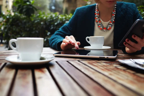 Woman using busy touch screen tablet