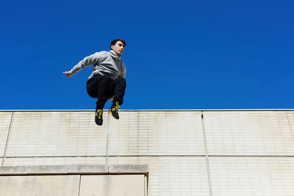 Male parkour free runner jumping