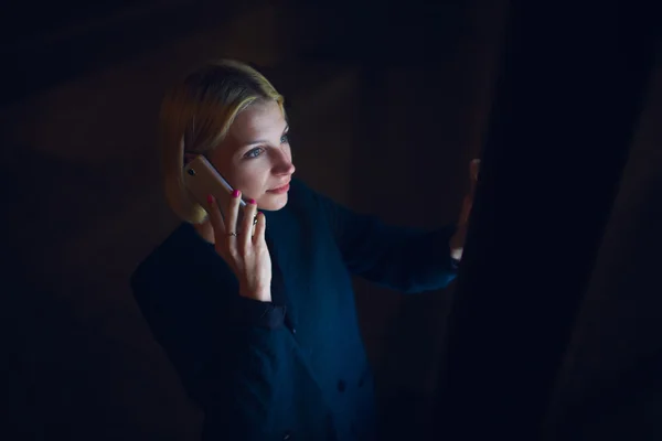 Woman  speaking on smartphone in city