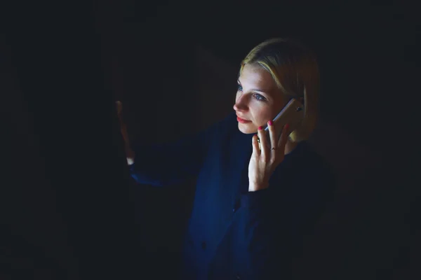 Woman  speaking on smartphone in city